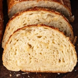 slices of asiago cheese bread on a table