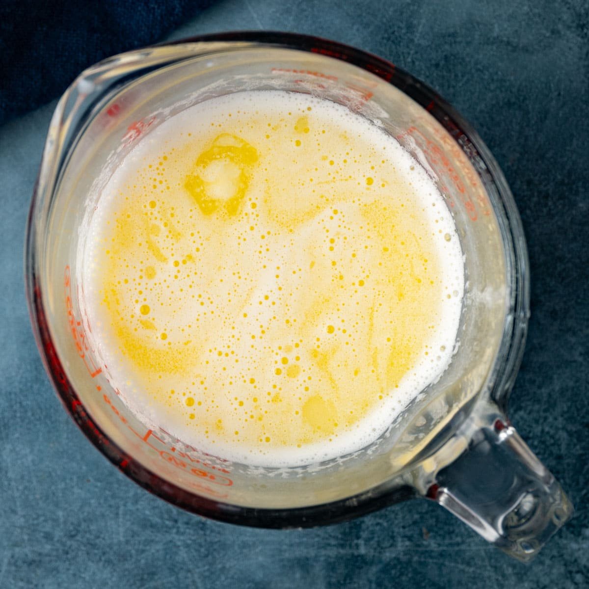 butter and milk in a measuring cup