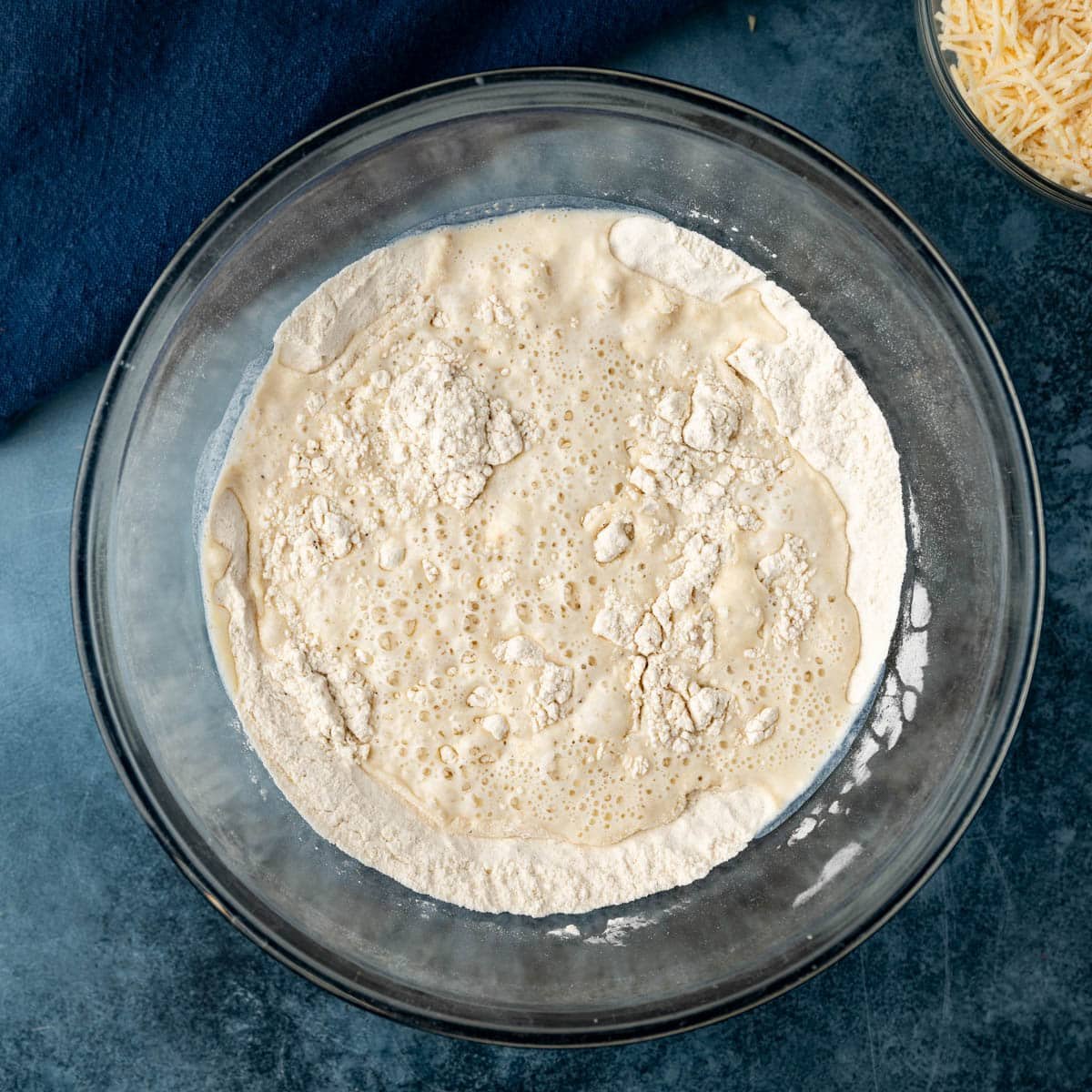 wet ingredients over dry ingredients in a bowl