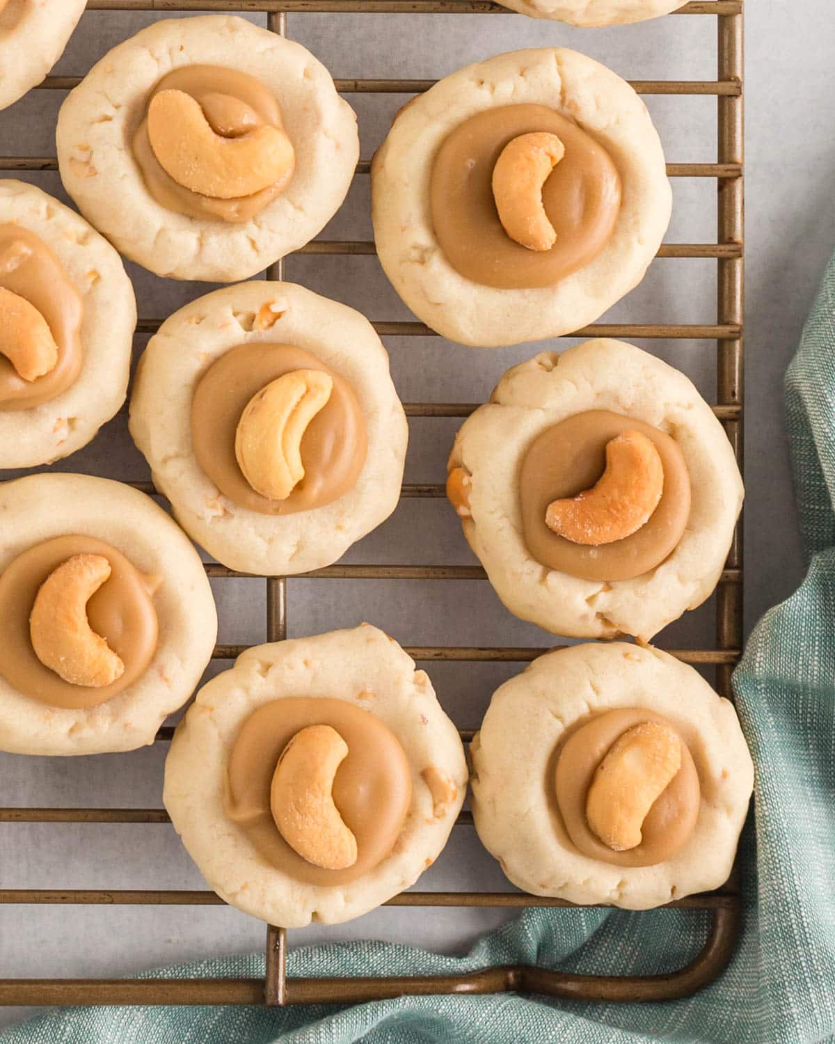caramel cashew cookies on a wire rack