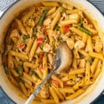 one pot spicy chicken pasta with a spoon