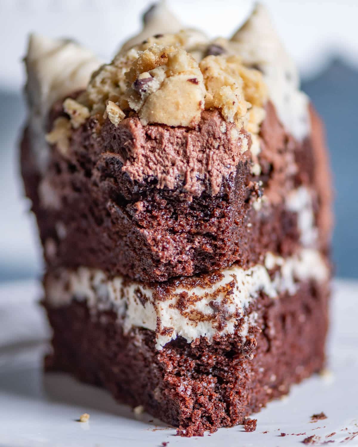 a piece of cookie dough cake on a plate with a bite out