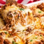 easy lasagna recipe with one piece on a spatula