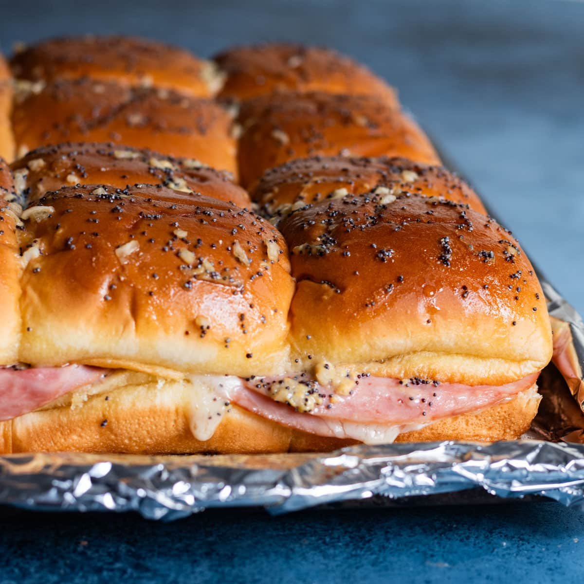 baked ham sliders with savory buttery sauce