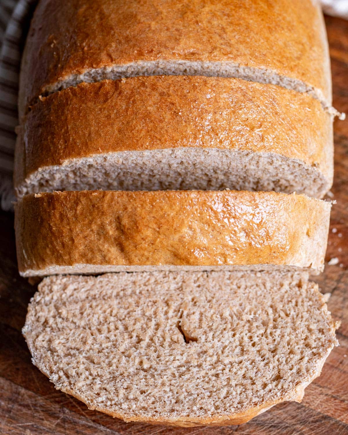 overhead view of sliced honey wheat bread