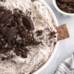 overhead view of oreo fluff in a bowl with a cracker