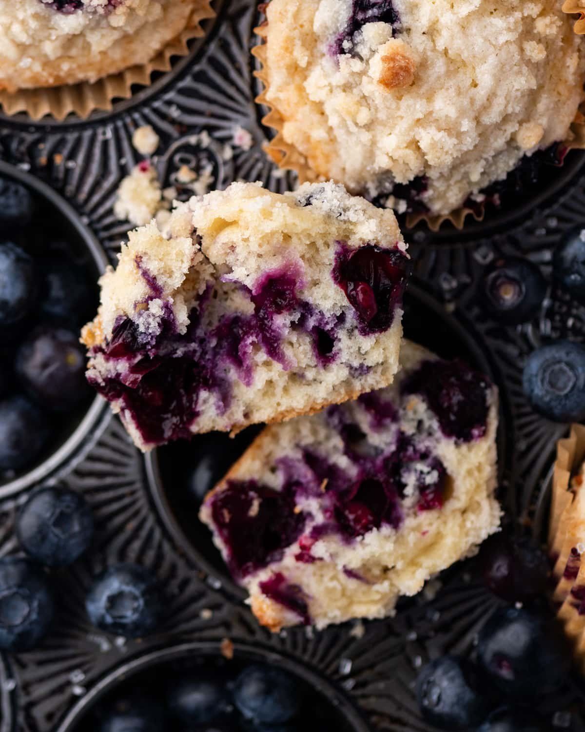 a blueberry muffin broken in half