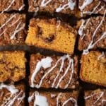 butterscotch coffee cake cut into squares, with powdered sugar glaze
