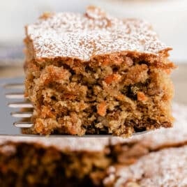 a piece of carrot and walnut cake on a spatula
