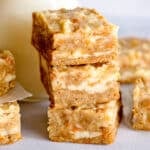 a stack of 3 carrot cake bars on a table