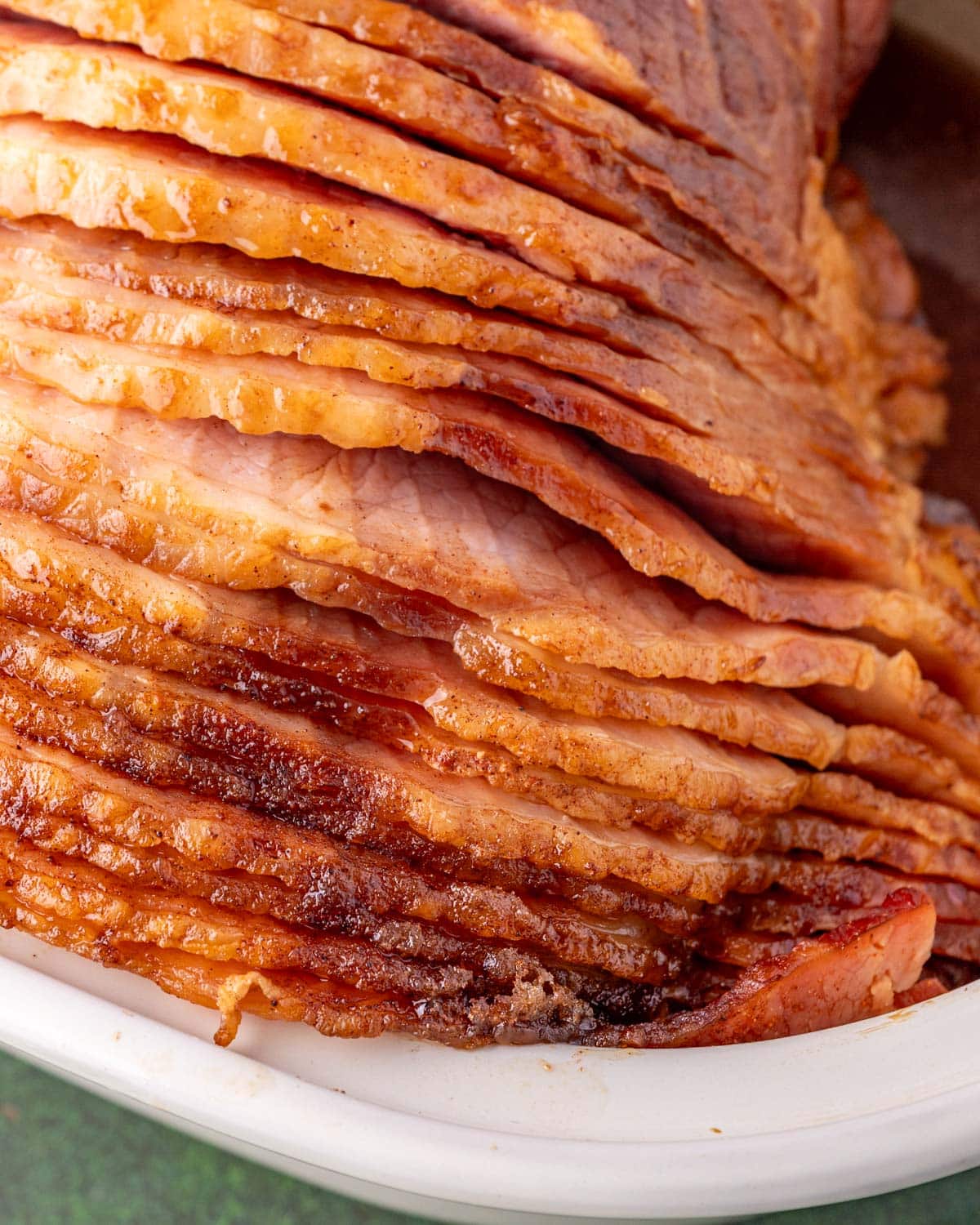 closeup of slices of spiral cut ham with brown sugar glaze