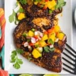 overhead view of tilapia with mango salsa