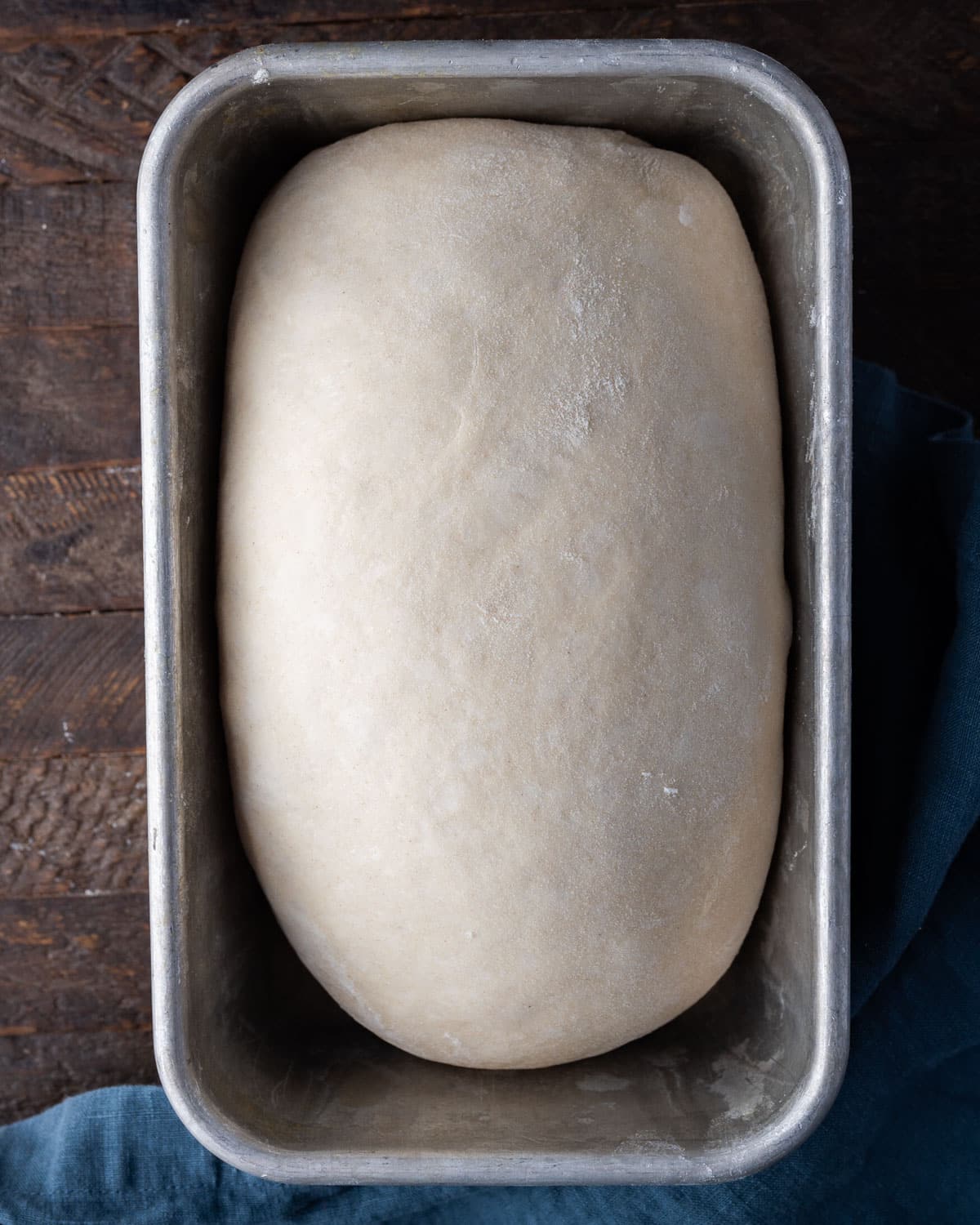 an unbaked loaf of bread in a bread pan