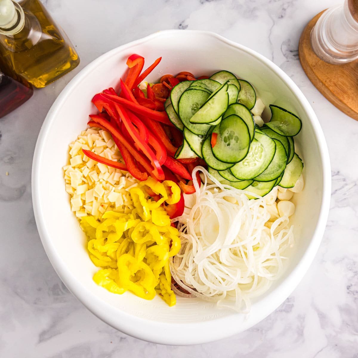 sliced vegetables for salad in a bowl