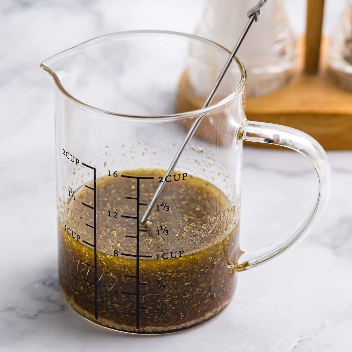 homemade vinaigrette in a measuring cup