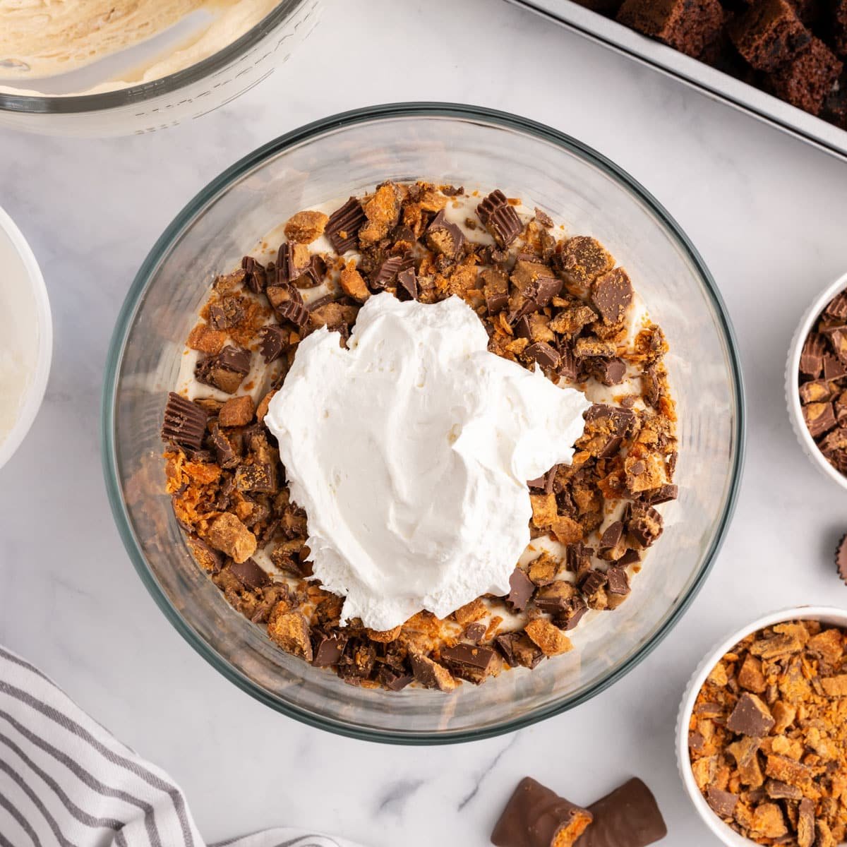 trifle with butterfinger and reese's cups with cool whip on top