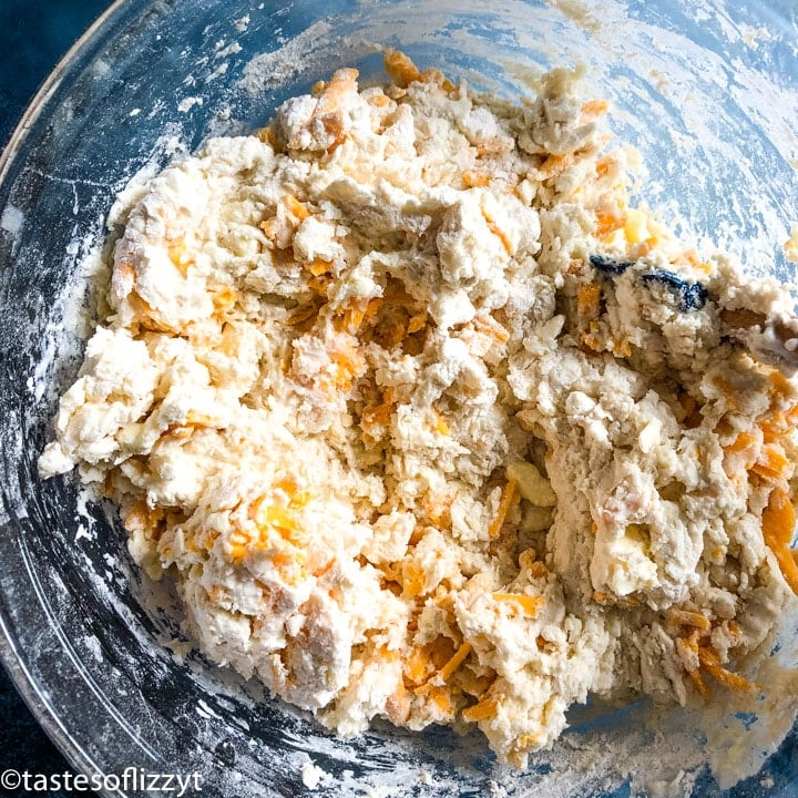 cornbread mix in a bowl with cheddar cheese