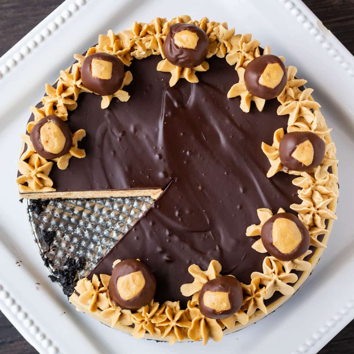 overhead view of a buckeye cheesecake with chocolate ganache