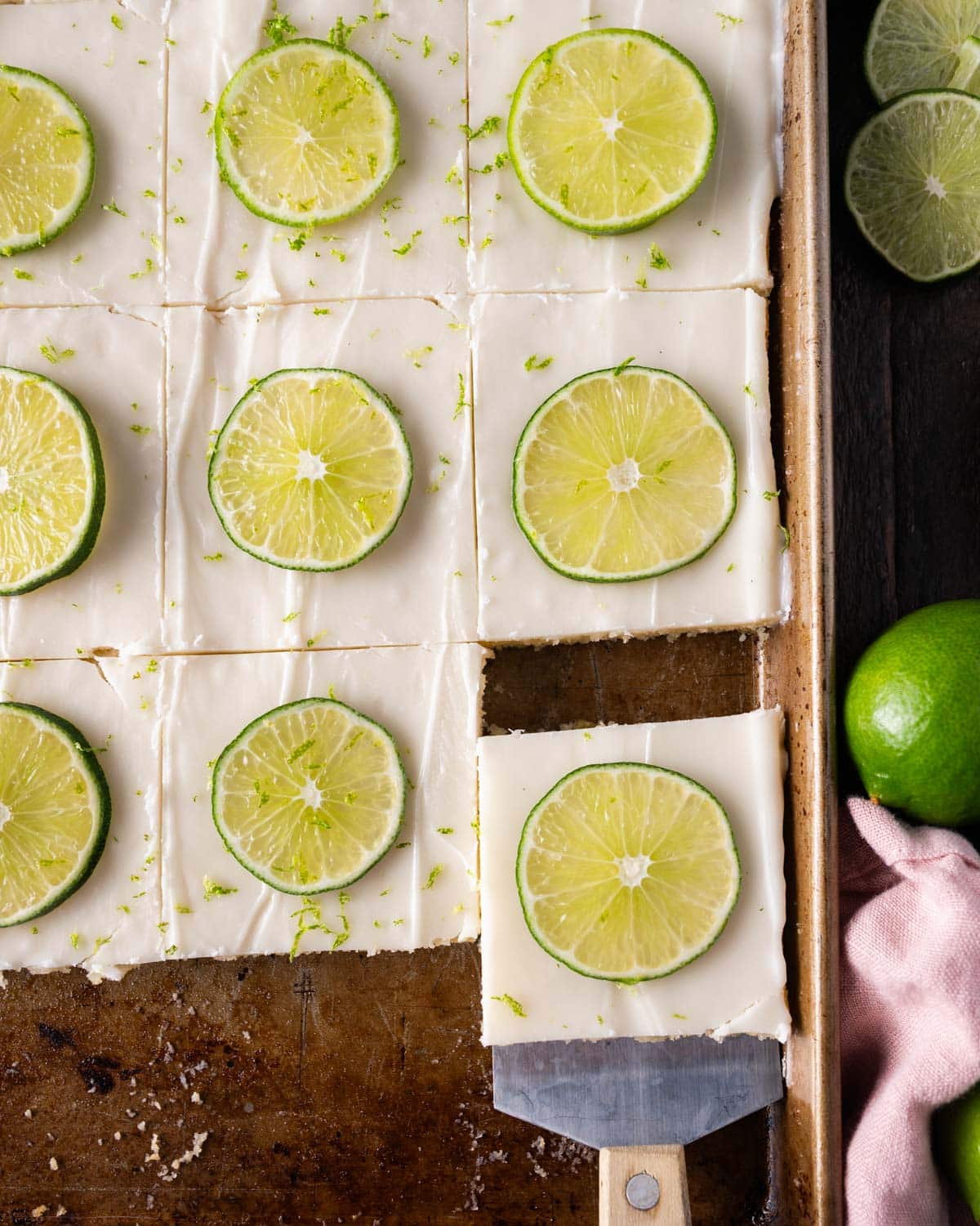 overhead view of sliced key lime sheet cake