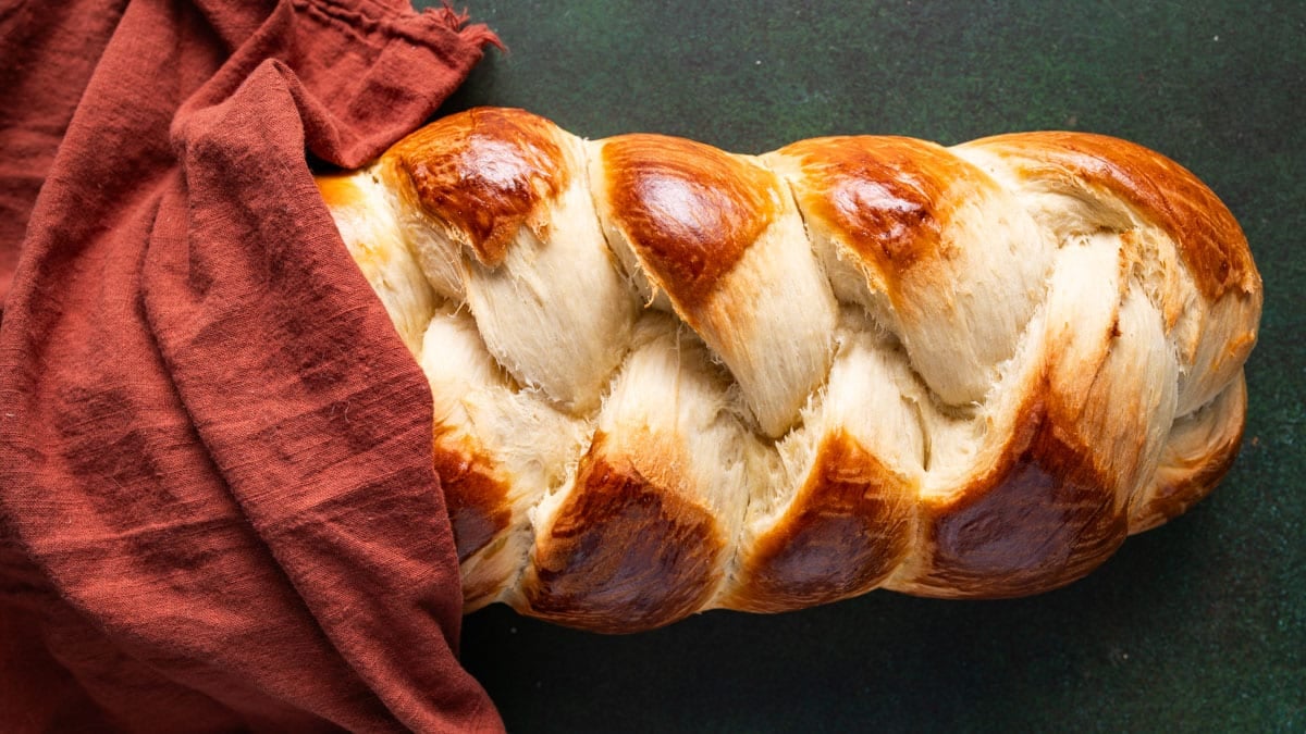 a loaf of egg twist bread laying on a table