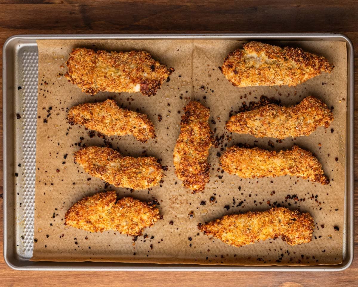 baked chicken tender on a baking sheet