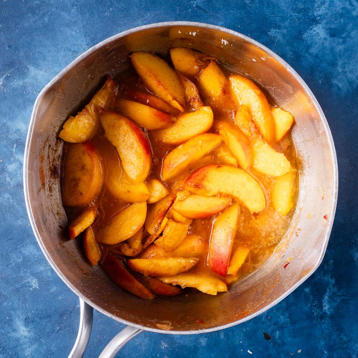 sliced peaches in a saucepan