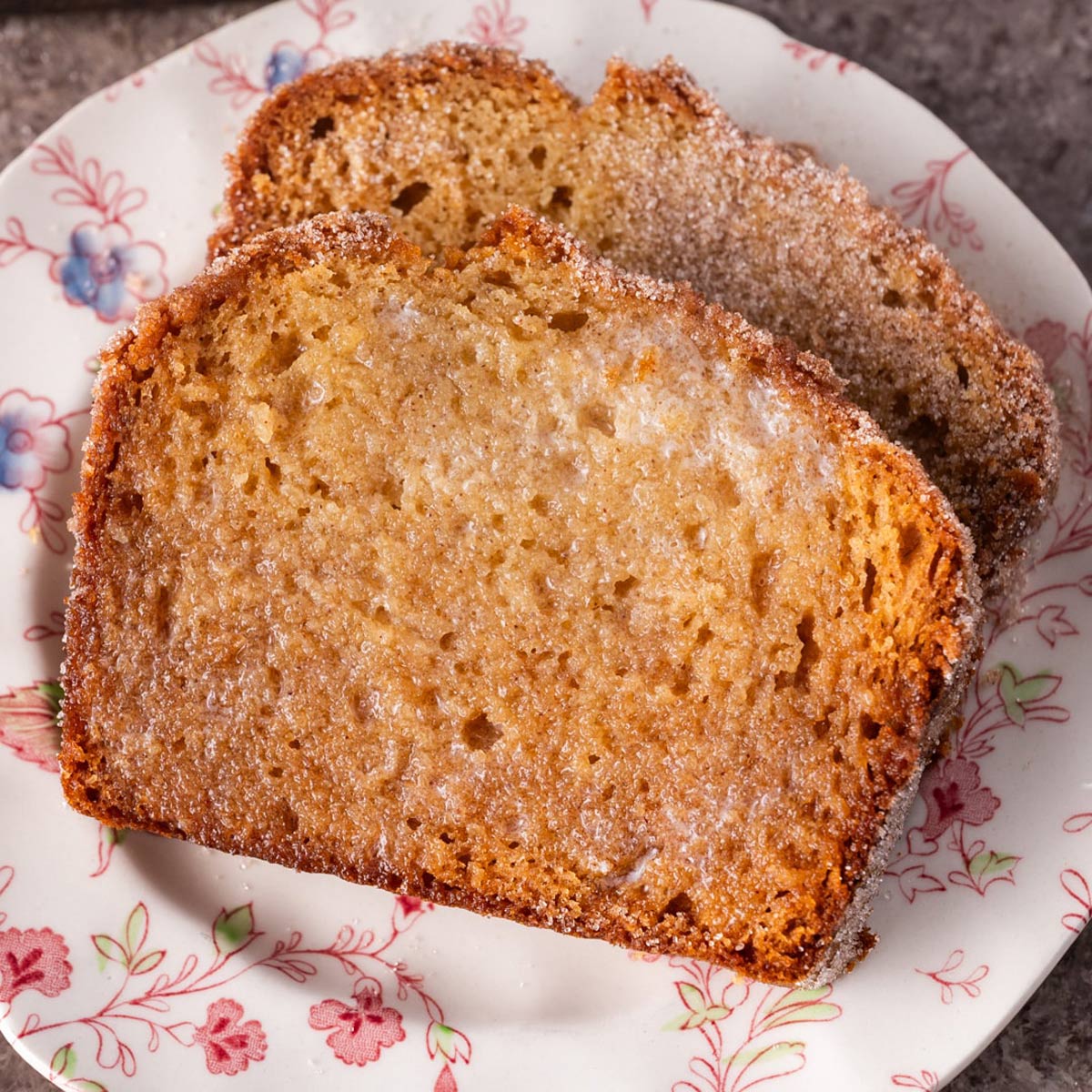 two slices of friendship bread with butter on a table