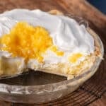 pineapple pie in a pie plate with one piece missing