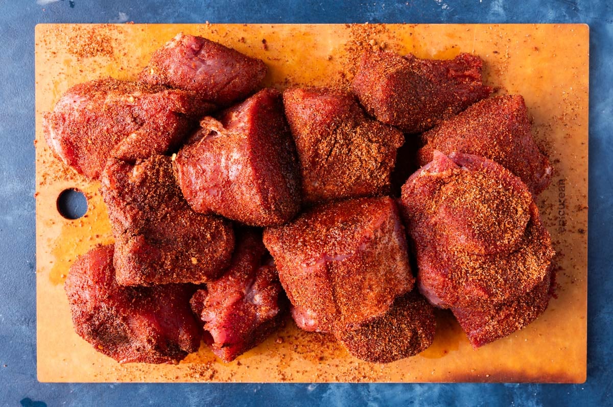 seasoned pork tenderloin on a cutting board