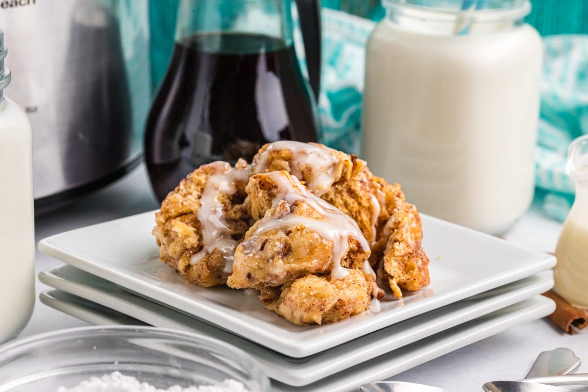 a scoop of cinnamon roll casserole on a plate