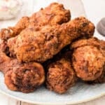 a plate of chicken fried drumsticks