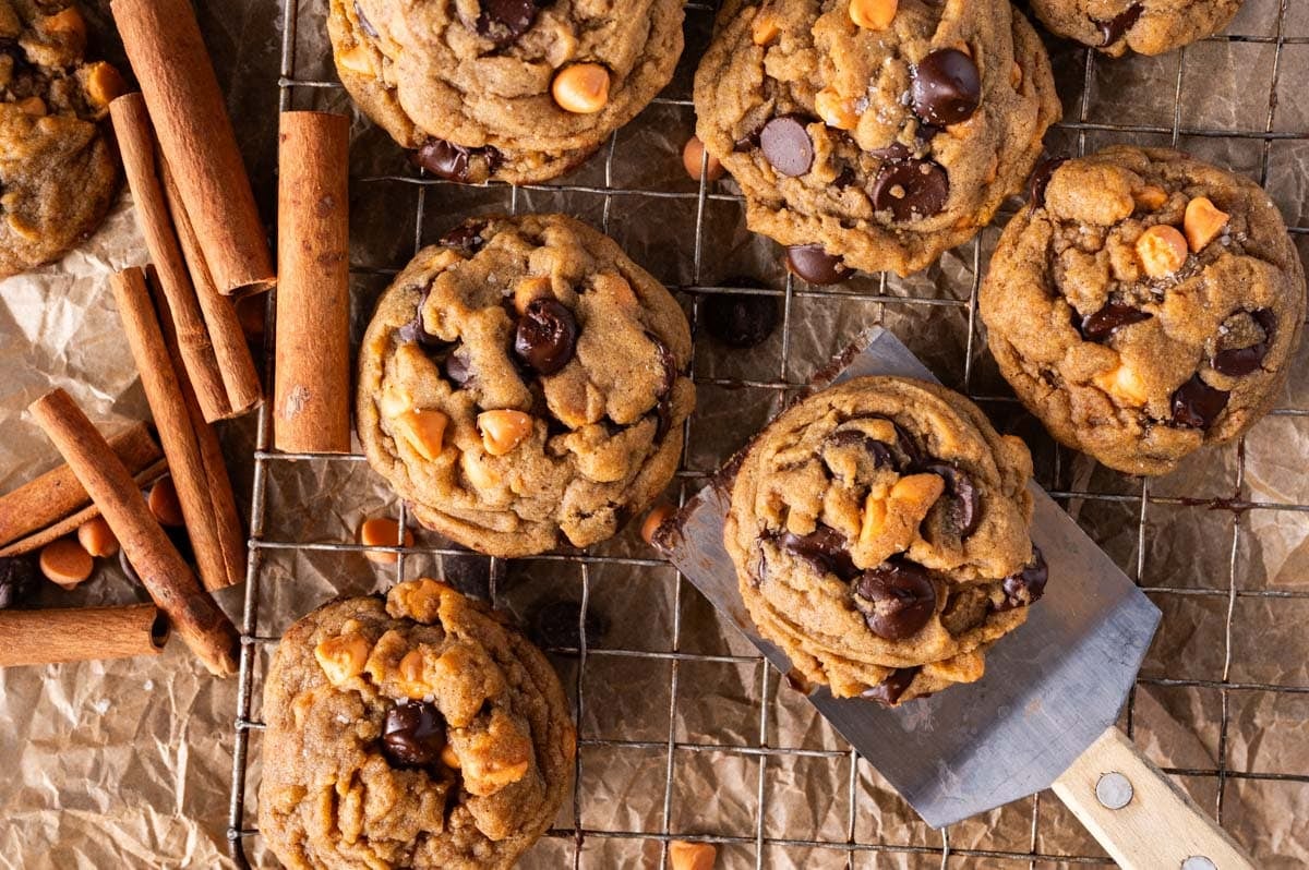 pumpkin spice chocolate chip cookies on a wire rack