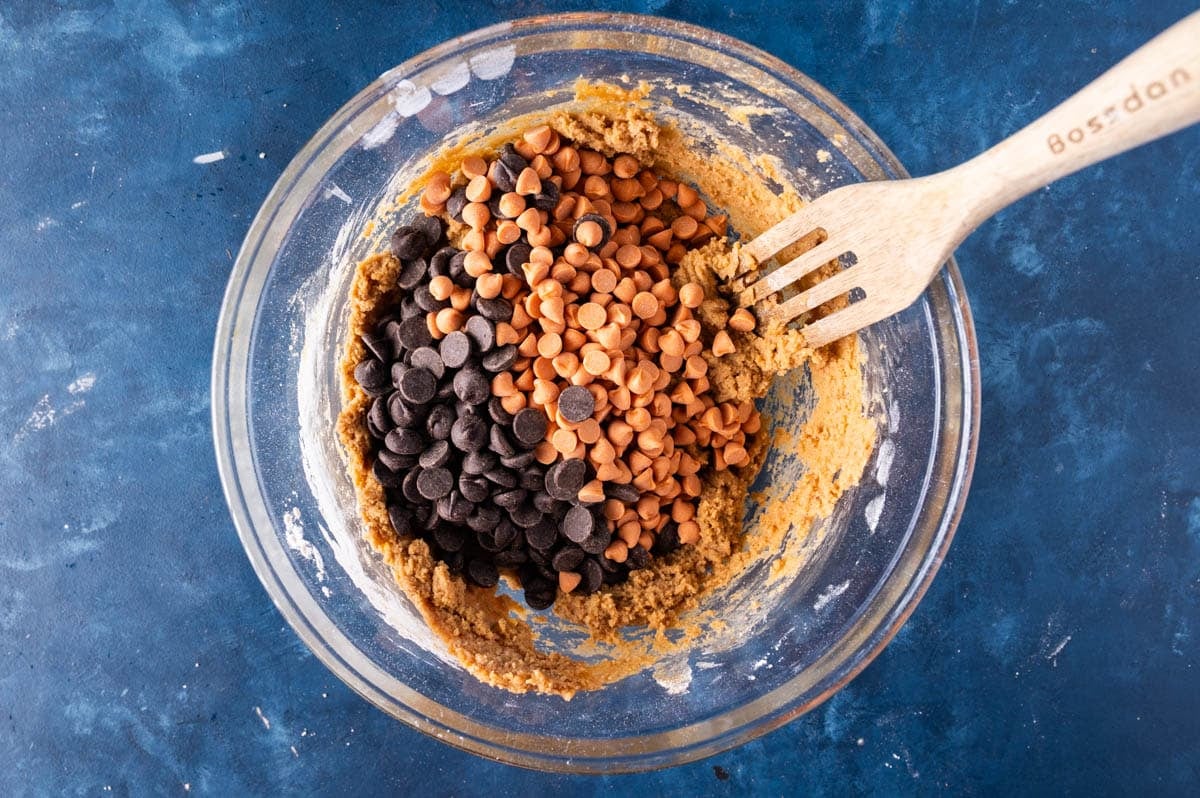 chocolate chips and pumpkin spice chips in a glass bowl