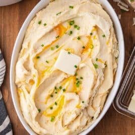 mashed potatoes with cheese and butter in a casserole dish