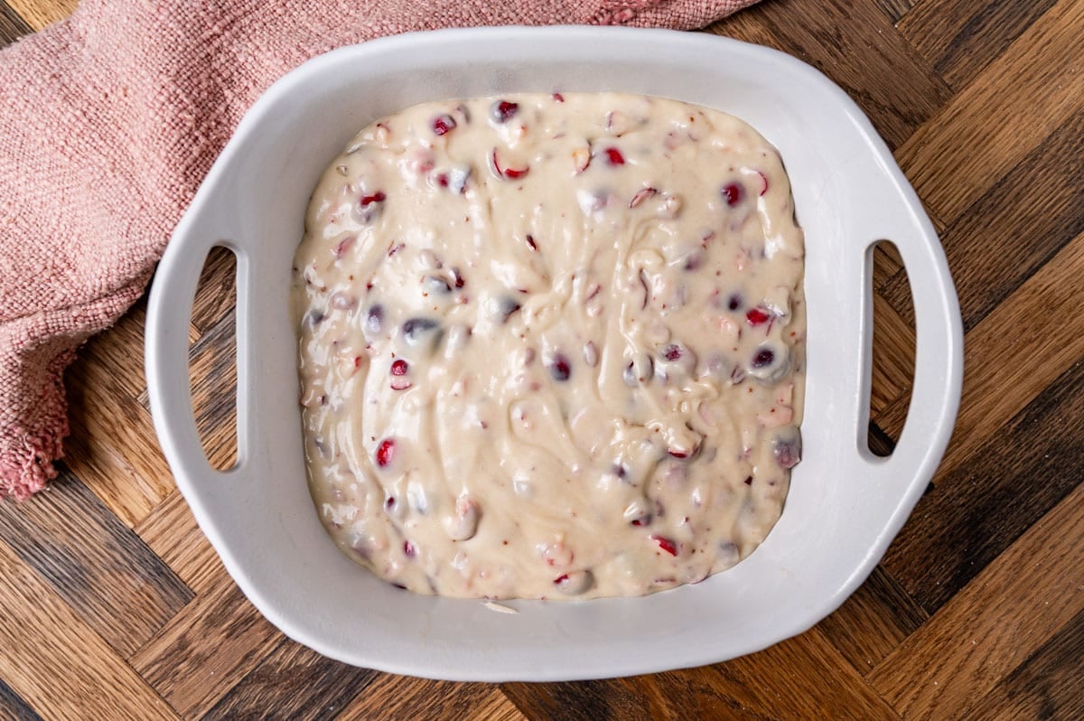 unbaked cranberry cake in a pan