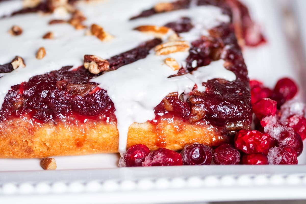 closeup of upside down cranberry cake with glaze