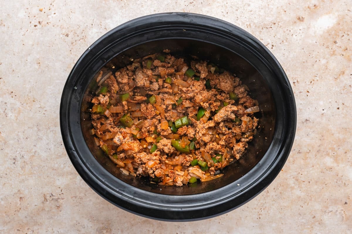 meat and veggie mix in a slow cooker liner