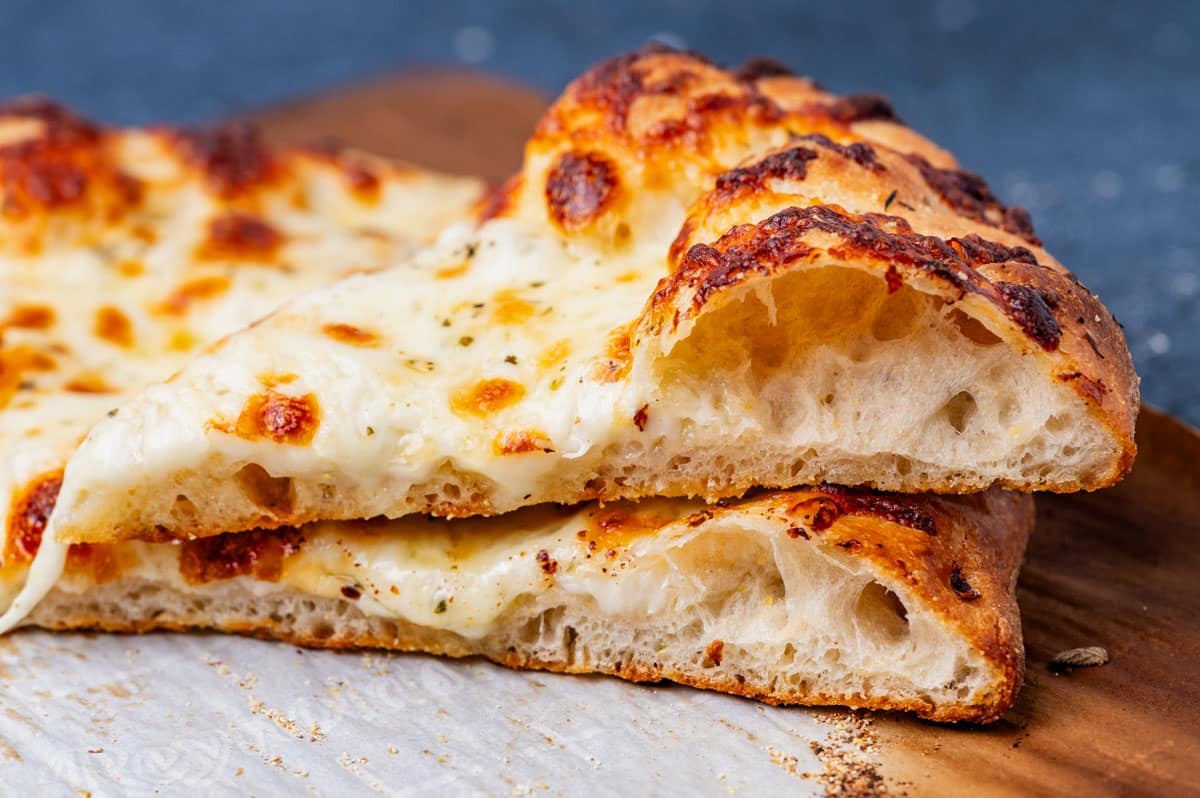 closeup of two sourdough pizza slices