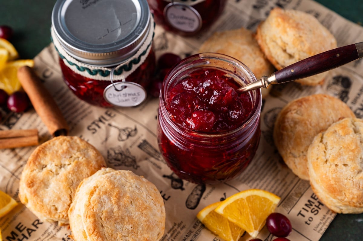 christmas jam in a jar on a table with biscuits
