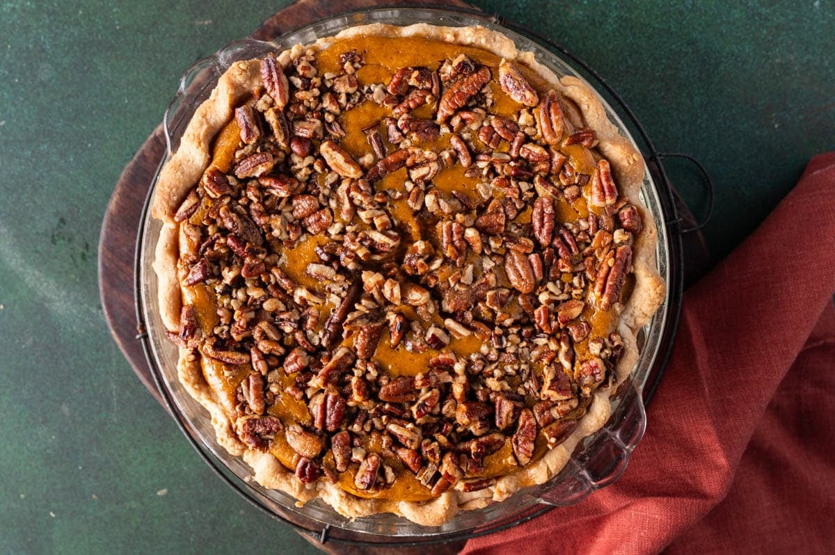 baked pecan pumpkin pie on a table