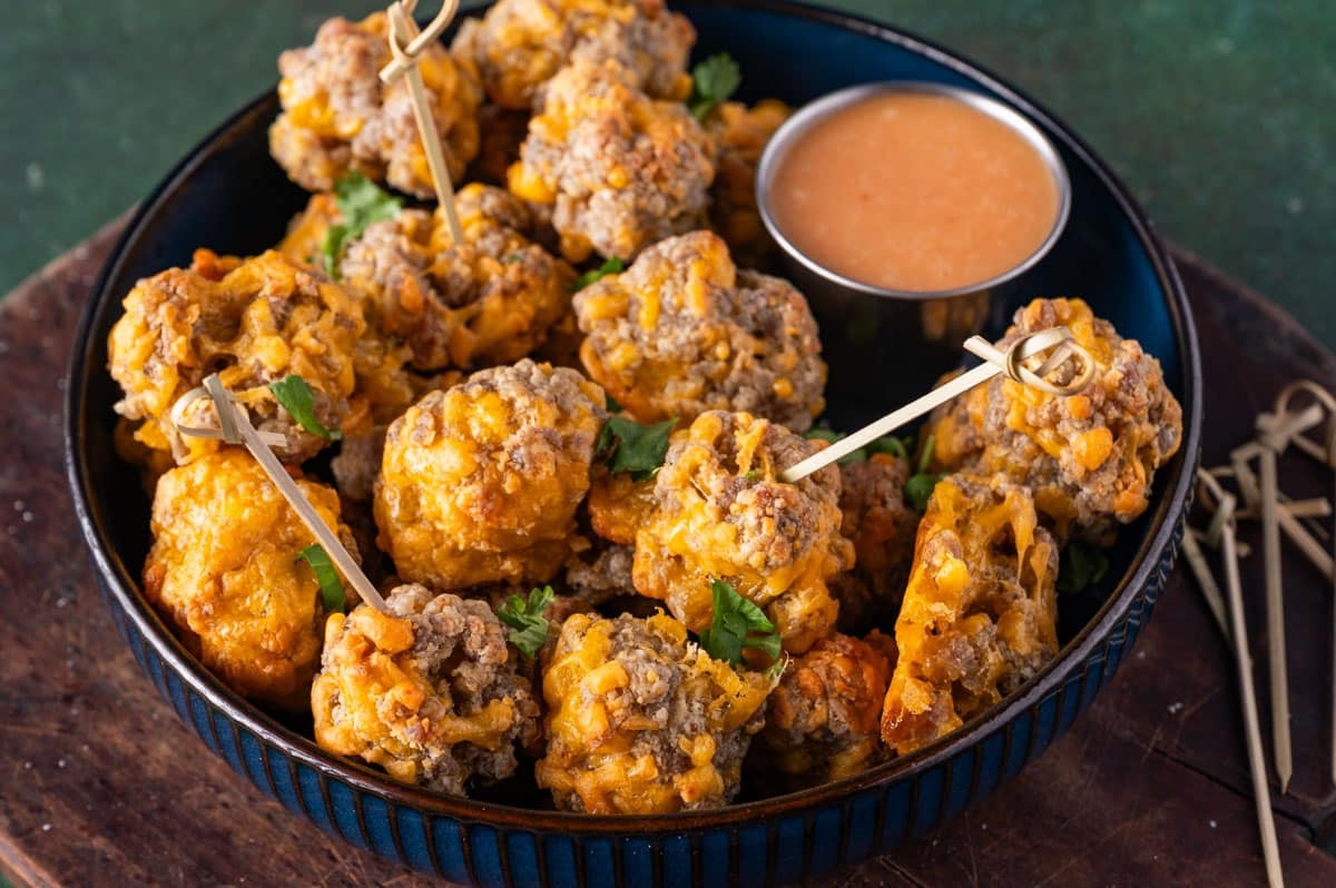 sausage balls in a plate with dip
