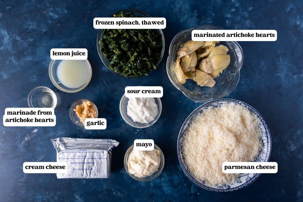 ingredients for spinach baked dip on a table