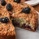 coffee cake with blackberries on a table