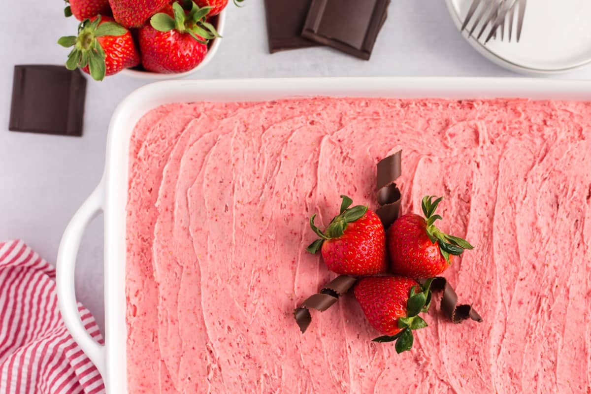 overhead view of chocolate strawberry cake with chocolate curls