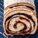 sliced cinnamon raisin bread on a wire rack