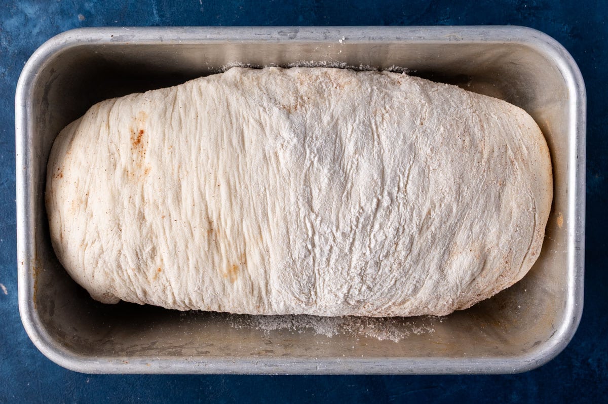 unbaked bread in a loaf pan