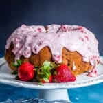 a glazed strawberry bundt cake on a table