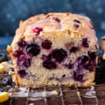 Lemon blueberry bread sitting on a wire rack