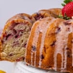 pulling out a slice of lemon strawberry cake