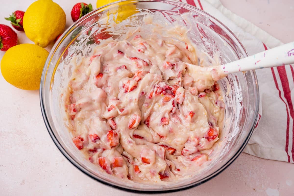 cake batter with strawberries in a bowl